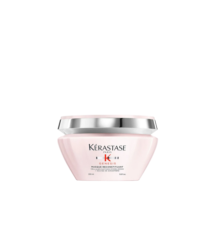 A jar of **Kérastase Genesis Masque Reconstituant**, a deeply nourishing hair mask designed to strengthen weakened hair and reduce hair fall due to breakage. The sleek, blush pink packaging highlights its fortifying formula, enriched with Edelweiss Native Cells and Ginger Root, to restore hydration, resilience, and smoothness for healthier, more resistant hair.