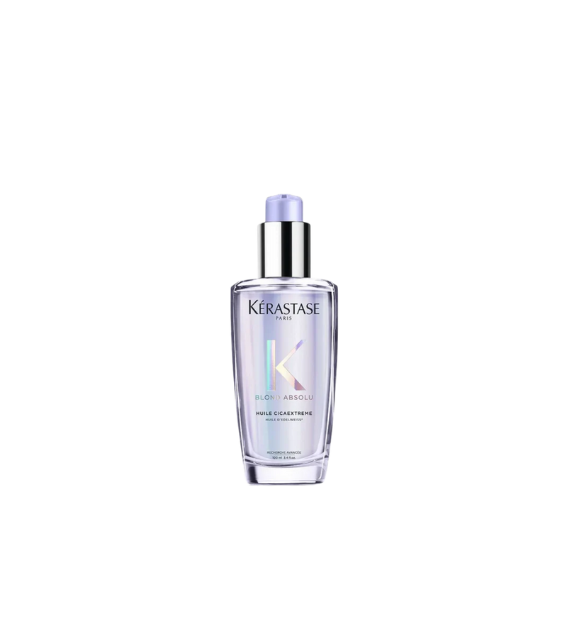 A bottle of **Kérastase Blond Absolu Cicaextreme Hair Repair Oil**, a luxurious, lightweight oil designed to deeply nourish and strengthen sensitized, bleached, or highlighted hair. Infused with edelweiss oil, it helps restore softness, smoothness, and shine while providing heat protection and reducing frizz for healthier, more resilient blonde hair.