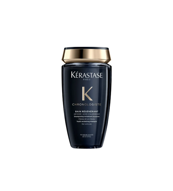 A bottle of **Kérastase Chronologiste Bain Régénérant**, a revitalizing shampoo that gently cleanses while restoring hydration, strength, and shine. Infused with hyaluronic acid, abyssine, and vitamin E, it combats signs of aging, smooths the hair fiber, and leaves hair feeling nourished and rejuvenated.