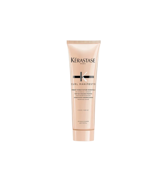 A bottle of **Kérastase Curl Manifesto Fondant Hydratation Essentielle**, a lightweight, hydrating conditioner designed to nourish and detangle curly, very curly, and coily hair. Infused with Manuka honey and ceramides, it enhances moisture retention, boosts curl definition, and leaves hair soft, smooth, and frizz-free.