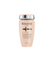 A bottle of **Kérastase Curl Manifesto Bain Hydratation Douceur**, a gentle, hydrating shampoo designed to cleanse and nourish curly, very curly, and coily hair. Enriched with Manuka honey and ceramides, it removes impurities while maintaining essential moisture, enhancing curl definition, and reducing frizz for soft, healthy curls.