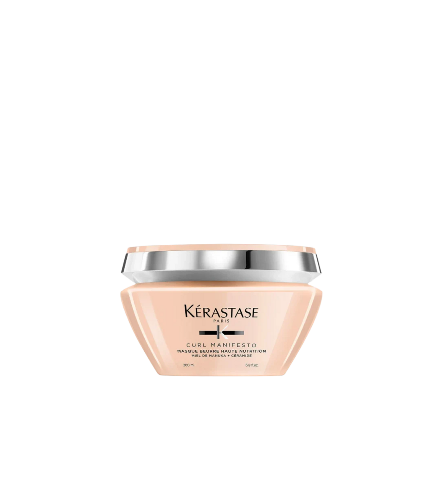 A jar of **Kérastase Curl Manifesto Masque Beurre Haute Nutrition**, an ultra-nourishing hair mask designed to deeply hydrate and strengthen curly, very curly, and coily hair. Infused with Manuka honey and ceramides, it restores moisture, improves elasticity, and enhances curl definition while reducing frizz and breakage.