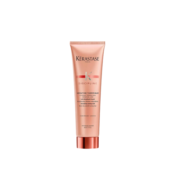 A bottle of **Kérastase Discipline Keratin Thermique Smoothing Heat Protectant Blow-Dry Primer**, a nourishing, anti-frizz cream that protects hair from heat damage while enhancing smoothness and manageability. Infused with Morpho-Kératine™ Complex, it tames frizz, reduces blow-dry time, and leaves hair soft, shiny, and effortlessly sleek.