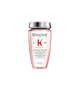 A bottle of **Kérastase Genesis Bain Hydra-Fortifiant**, a lightweight fortifying shampoo designed for thin, weakened hair prone to hair fall due to breakage. The sleek, blush pink packaging highlights its gentle, cleansing formula, enriched with Edelweiss Native Cells and Ginger Root, to strengthen, purify the scalp, and improve resilience while maintaining softness and hydration.