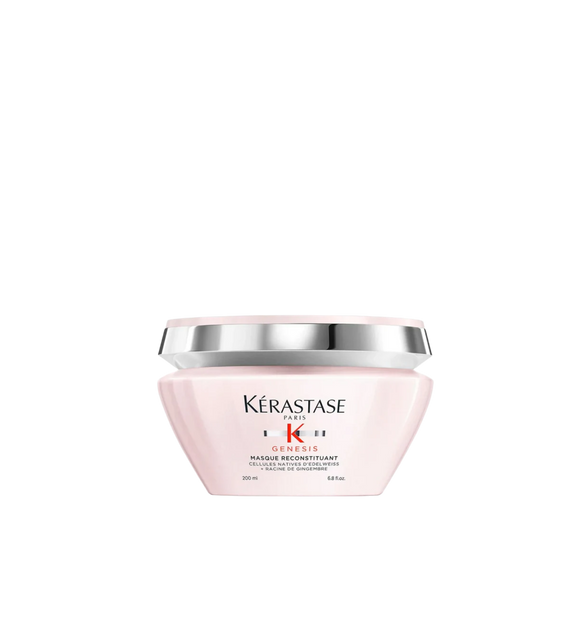 A jar of **Kérastase Genesis Masque Reconstituant**, a deeply nourishing hair mask designed to strengthen weakened hair and reduce hair fall due to breakage. The sleek, blush pink packaging highlights its fortifying formula, enriched with Edelweiss Native Cells and Ginger Root, to restore hydration, resilience, and smoothness for healthier, more resistant hair.