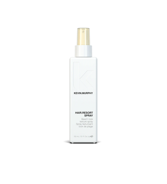 A bottle of **KEVIN.MURPHY HAIR.RESORT.SPRAY**, a lightweight, texturizing spray designed to create effortlessly tousled, beachy waves with a natural-looking hold. Infused with hydrating ingredients, it enhances volume and texture while leaving hair with a matte finish and flexible movement.