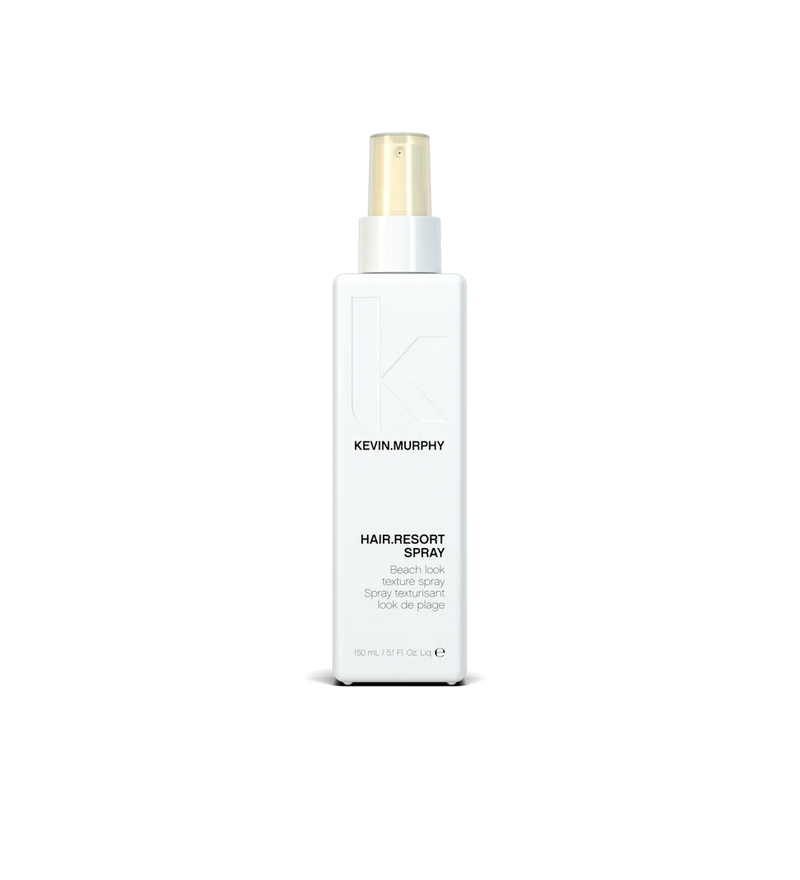 A bottle of **KEVIN.MURPHY HAIR.RESORT.SPRAY**, a lightweight, texturizing spray designed to create effortlessly tousled, beachy waves with a natural-looking hold. Infused with hydrating ingredients, it enhances volume and texture while leaving hair with a matte finish and flexible movement.