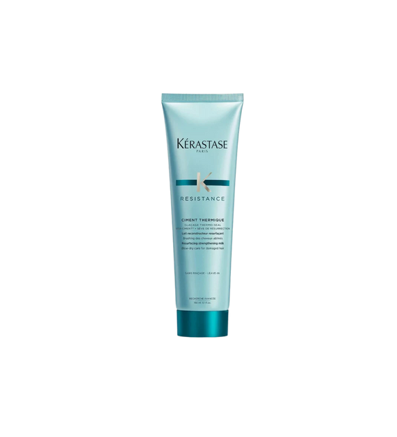 A bottle of **Kérastase Résistance Ciment Thermique**, a blow-dry primer designed to strengthen and protect damaged hair from heat styling. This lightweight, leave-in treatment helps prevent breakage while smoothing and fortifying hair for a sleek, healthy finish.