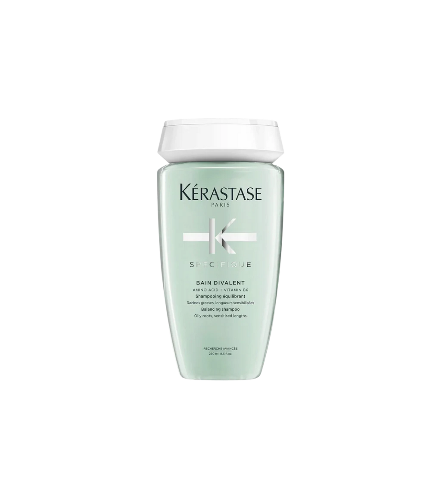 A bottle of **Kérastase Spécifique Bain Divalent**, a balancing shampoo formulated for oily scalps and dry ends. It gently cleanses, regulates excess oil, and nourishes lengths for refreshed, healthy-looking hair.