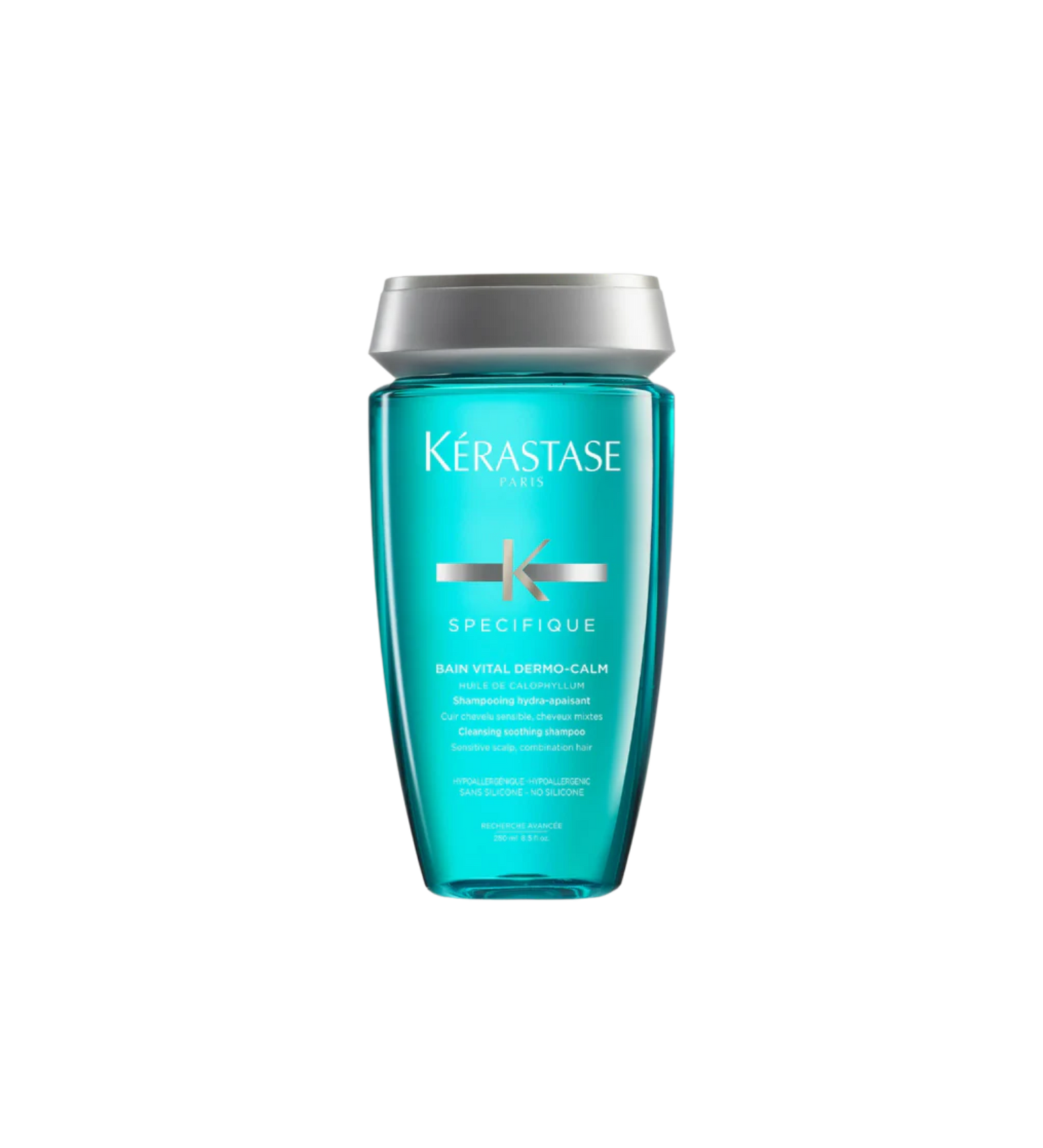 A bottle of **Kérastase Spécifique Bain Vital Dermo-Calm Shampoo**, a gentle, soothing formula designed for sensitive scalps. Infused with calming ingredients, it cleanses while reducing scalp discomfort, irritation, and dryness, leaving hair feeling fresh, light, and hydrated.