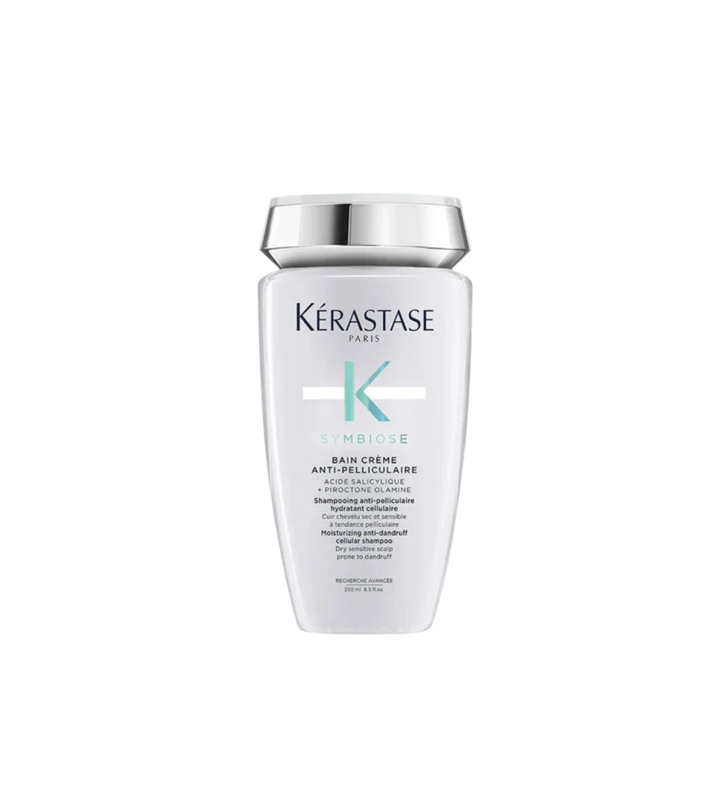 A bottle of **KERASTASE SYMBIOSE CRÈME HYDRATING ANTI-DANDRUFF SHAMPOO**, a luxurious, hydrating shampoo designed to gently remove dandruff while nourishing the scalp. Its rich, creamy formula soothes irritation, restores moisture, and leaves hair feeling soft, healthy, and flake-free. Perfect for dry, sensitive scalps in need of gentle yet effective care.