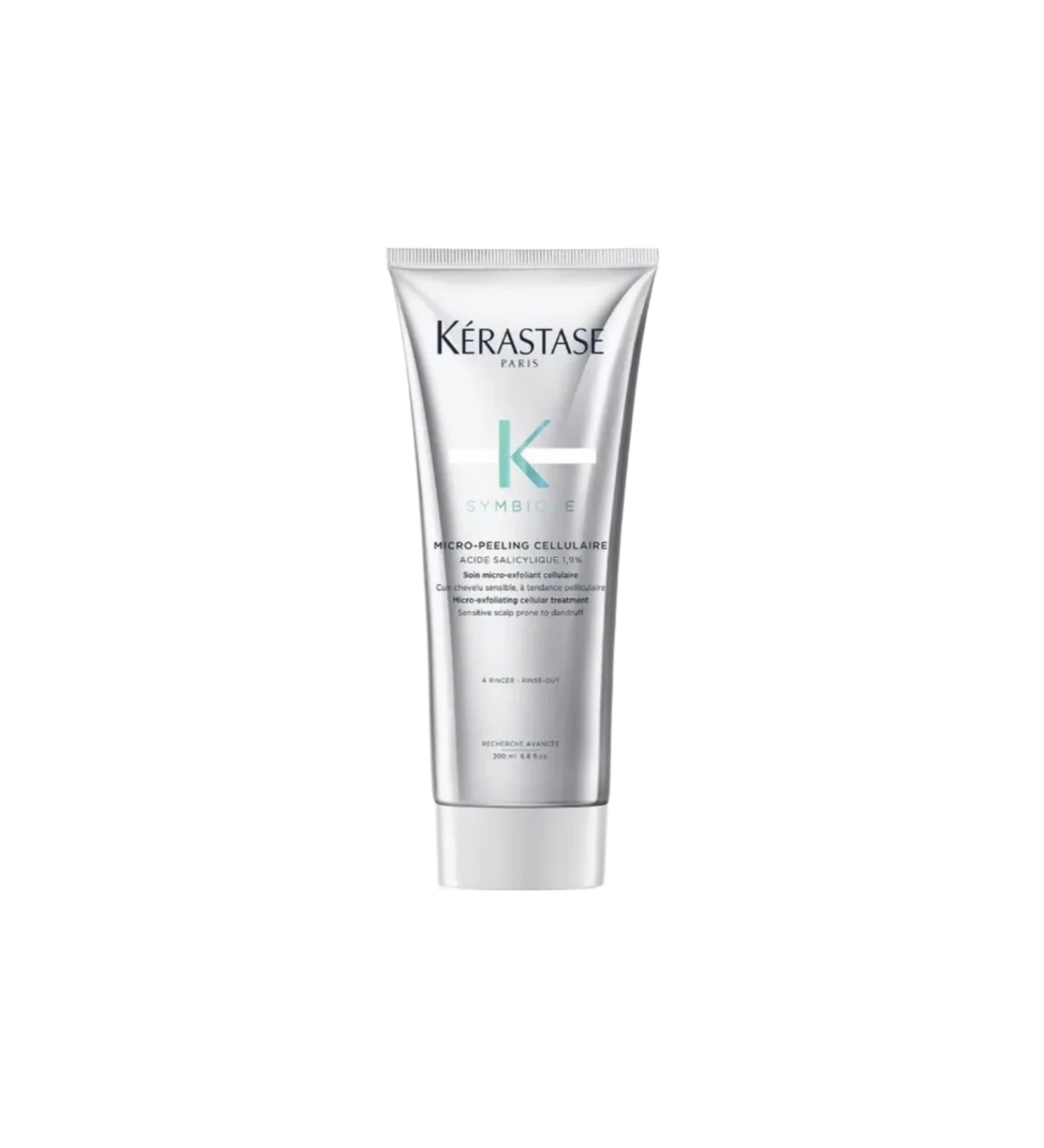 A jar of **Kérastase Symbiose Micro-Exfoliating Cellular Scalp Scrub**, a purifying treatment that gently exfoliates the scalp to remove dandruff flakes, excess oil, and buildup. Infused with salicylic acid and plant-based exfoliants, it helps refresh and rebalance the scalp for a healthier, flake-free feel.